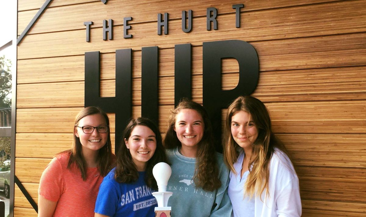 Members of the Females in Computer Science + Information Technology aka "Fix It" Club pose outside of the Hurt Hub