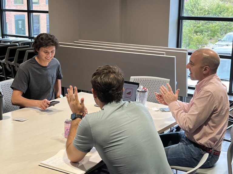 Thomas Athey ’24, co-founder of MESA, meets with mentors Owen Bezick ’21, founder of GatherWare, and Evan Rozantes, the…