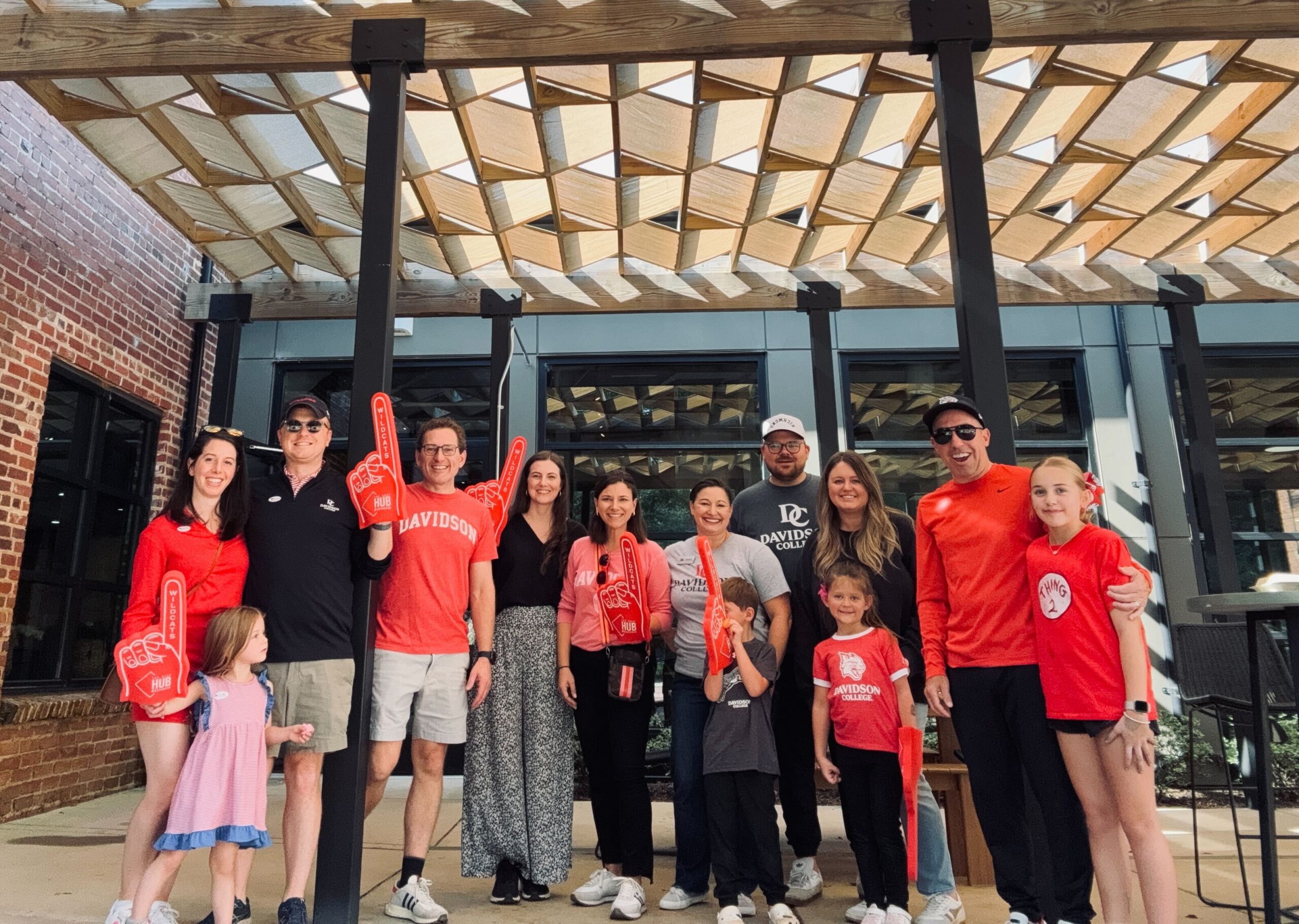 Dr. Chris Marsicano '10 and his family with Hurt Hub staff during a Wildcat Weekend event.