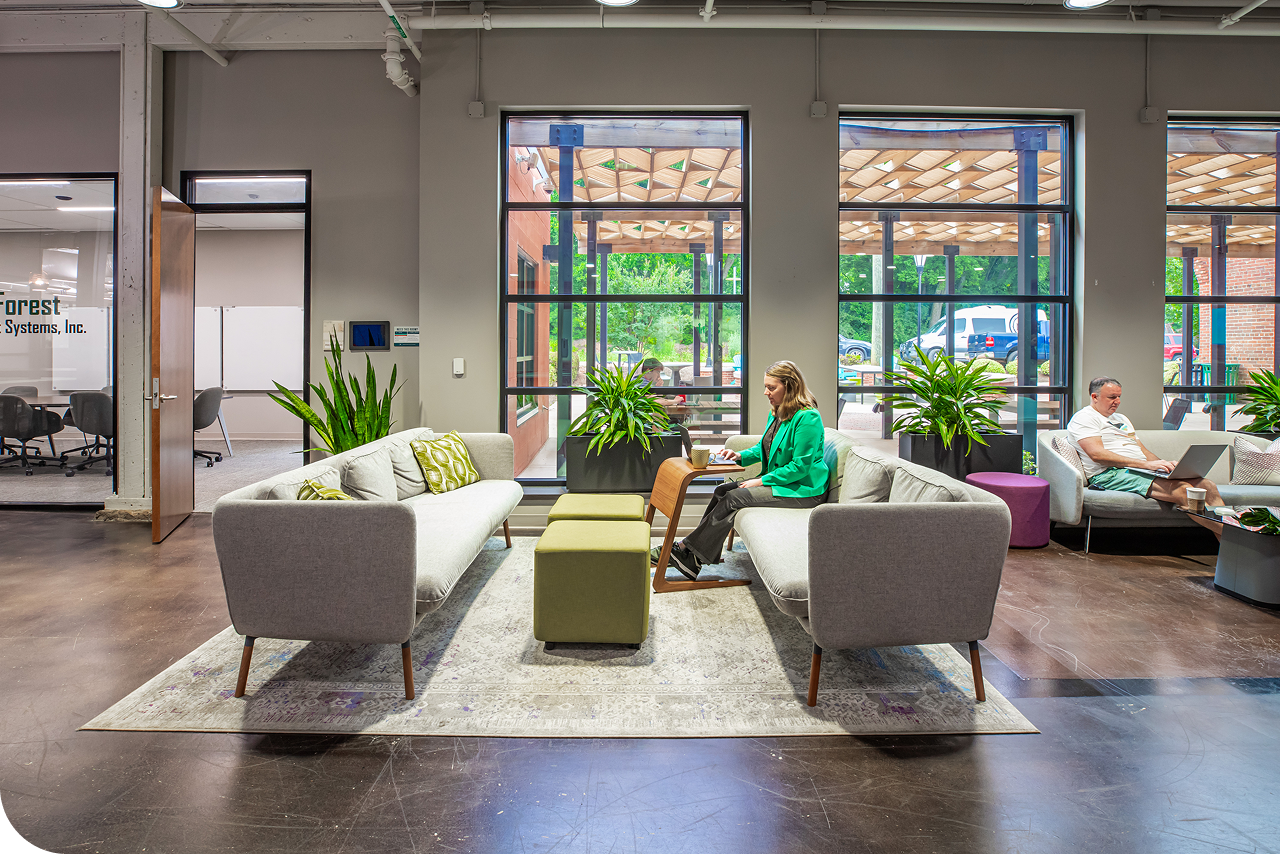 Coworkers at work in the Hurt Hub lounge