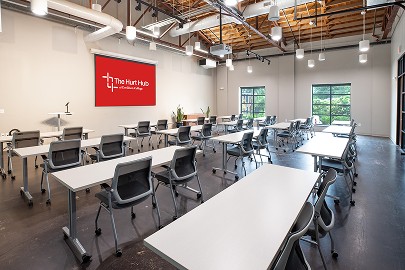 Event Room 303 — a large classroom laid out with tables and chairs